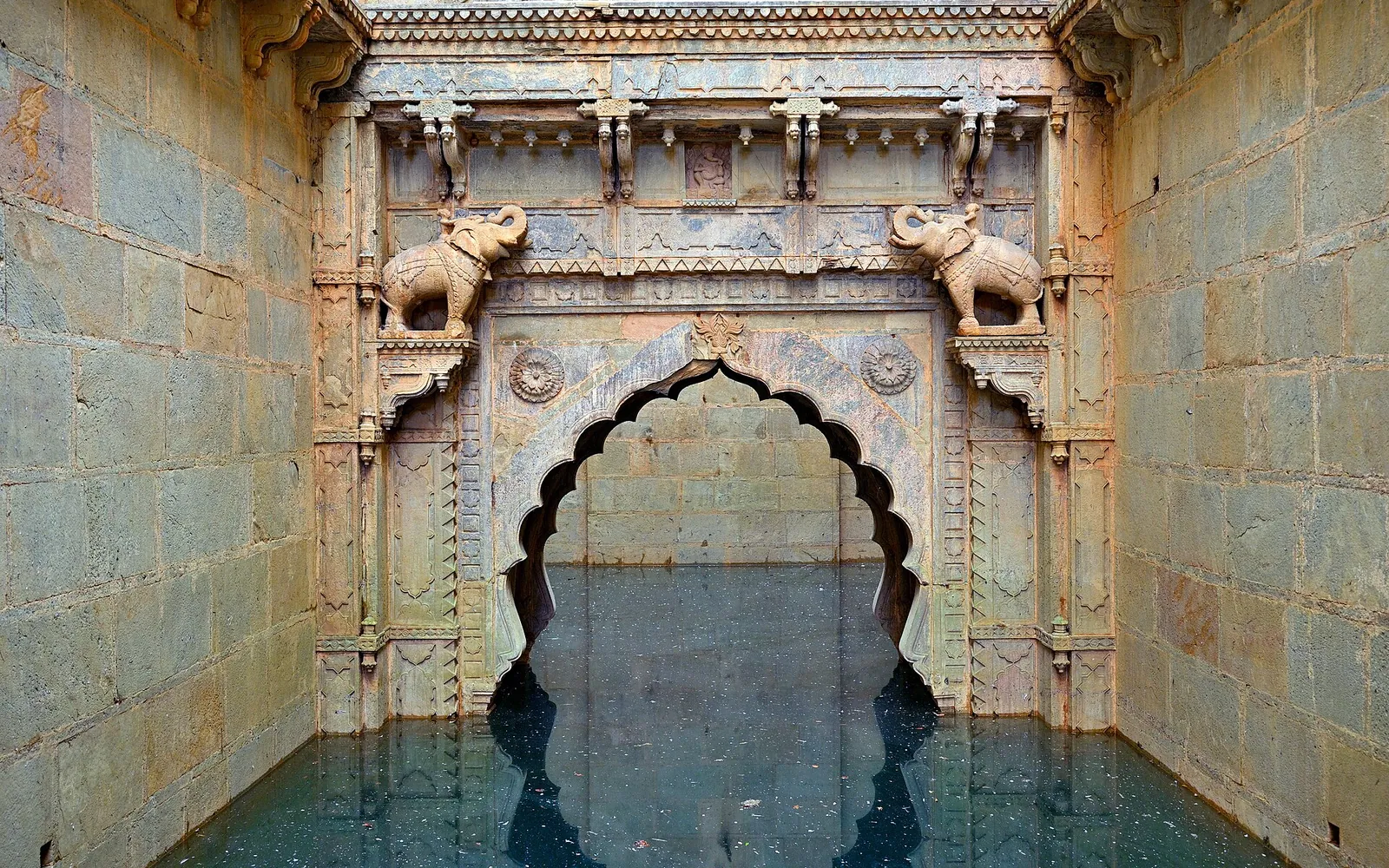 Steps and carved arches inside Raniji ki Baori stepwell, Bundi
